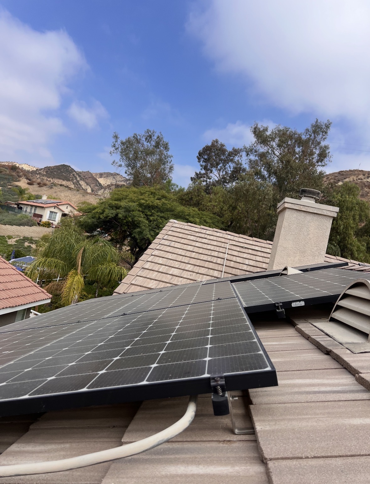 Solar panels before cleaning with mountain view
